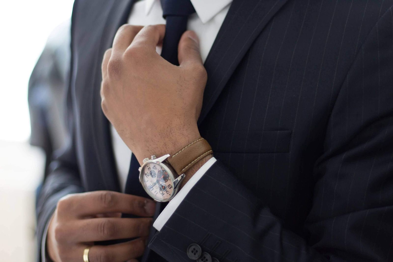 A groom preparing before a notary-officiated ceremony